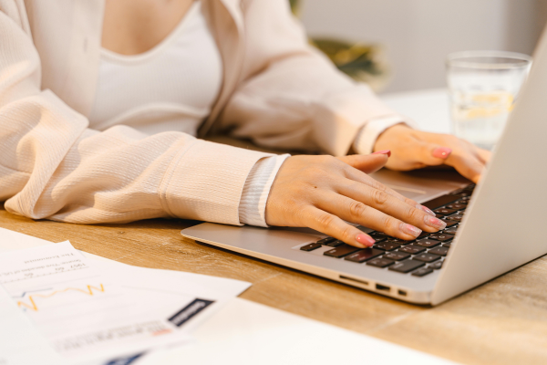 Woman types at keyboard preparing for family proceedings